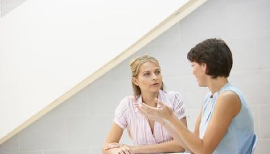 Two women have a discussion Two women have a discussion