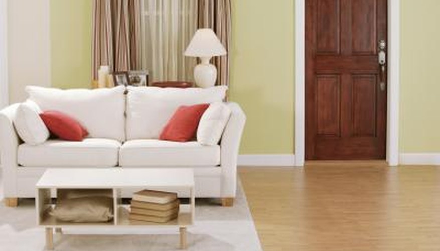 This tuxedo-style sofa has extra back and side pillows to soften the trim lines of the back and arms. This tuxedo-style sofa has extra back and side pillows to soften the trim lines of the back and arms.