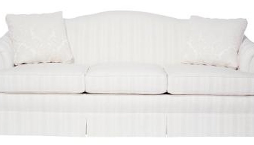 A camelback sofa looks less formal with a skirt. A camelback sofa looks less formal with a skirt.