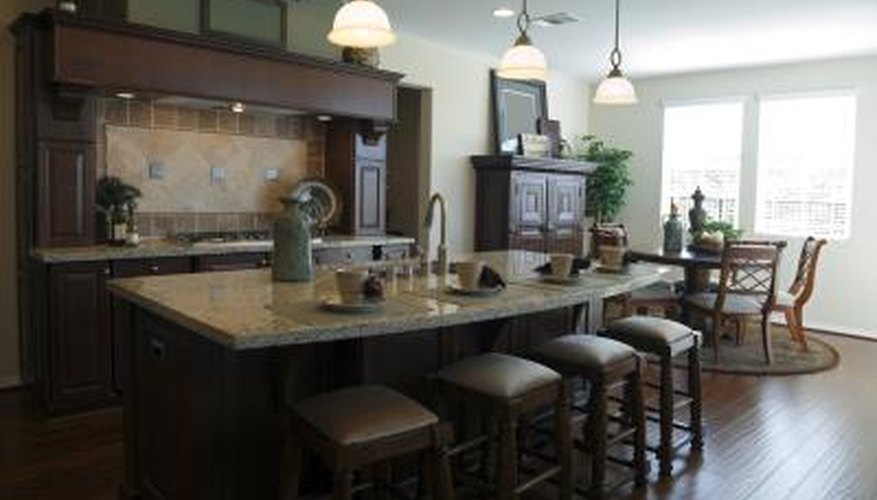 The NKBA recommends that the space between the island and adjacent counters or appliances should be at least 42 inches for one cook and 48 inches for two or more. The NKBA recommends that the space between the island and adjacent counters or appliances should be at least 42 inches for one cook and 48 inches for two or more.