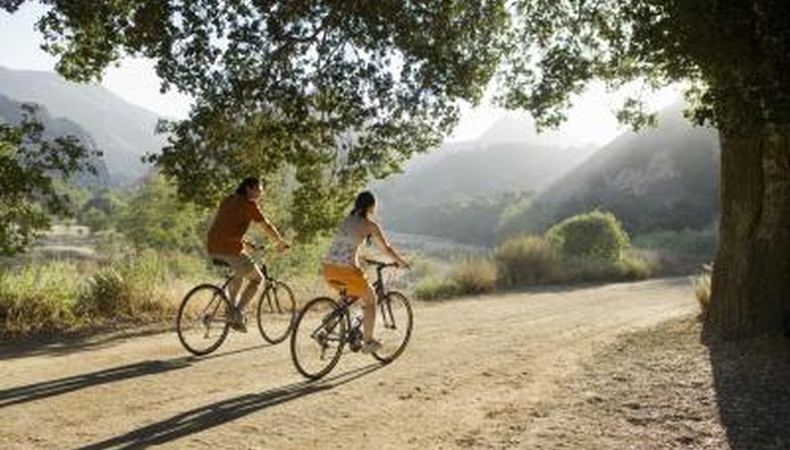 Young couple riding bicycles. Young couple riding bicycles.