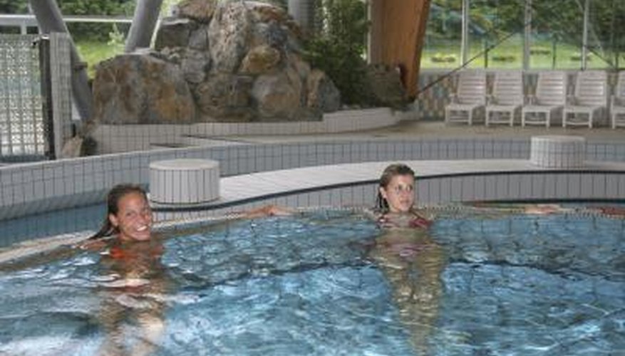 Two women in large indoor hot tub Two women in large indoor hot tub