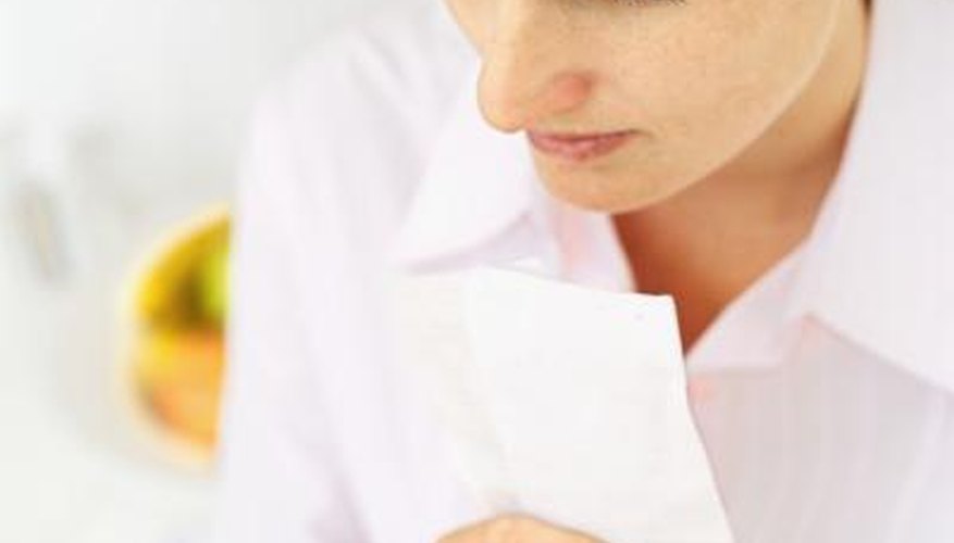 Women thinking with list in hand Women thinking with list in hand