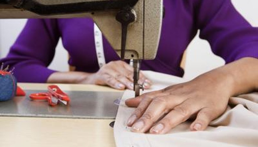 Woman using sewing machine Woman using sewing machine