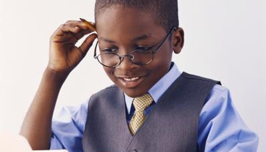Young boy doing math problem. Young boy doing math problem.