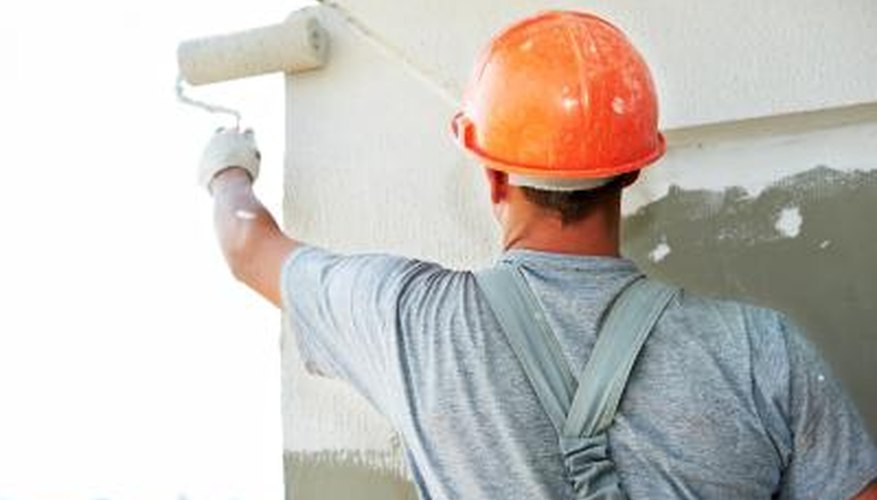 man painting exterior of house man painting exterior of house