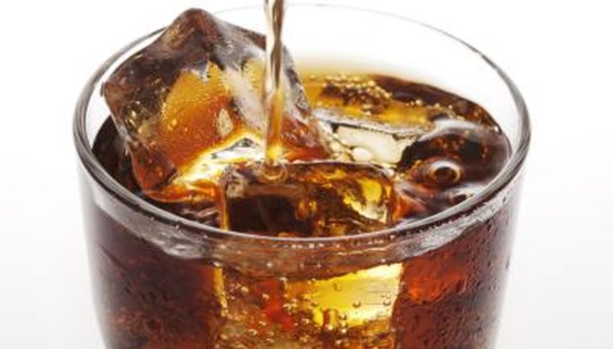 Soak pennies in soda. Soak pennies in soda.