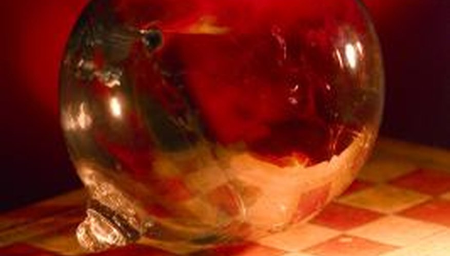 Glass orbs reflect some of the light from the lit bulb. Glass orbs reflect some of the light from the lit bulb.