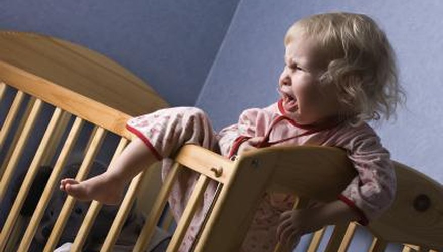 Uncomfortable infant in crib. Uncomfortable infant in crib.