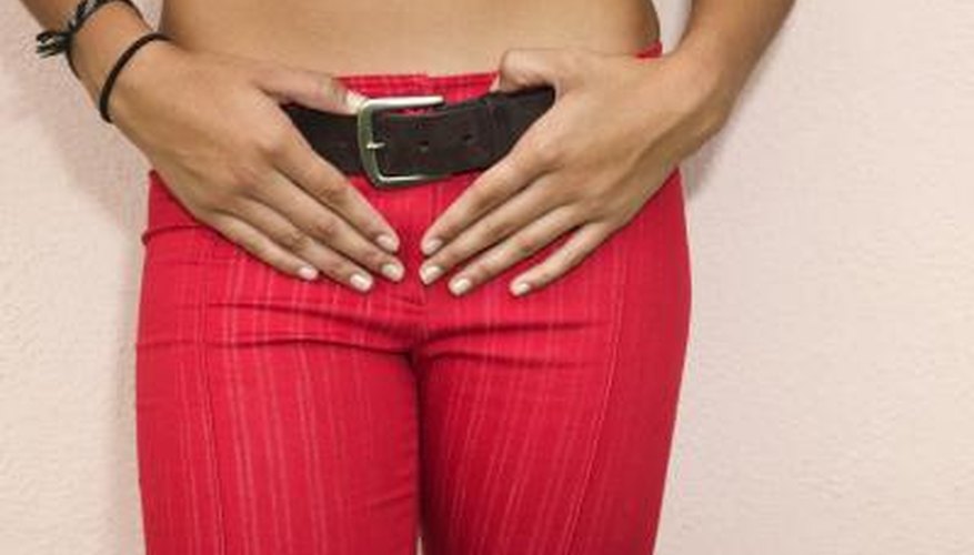 Woman holding hands on belt Woman holding hands on belt