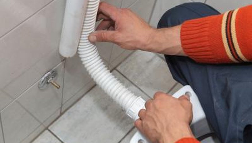 Plumber installing toilet Plumber installing toilet