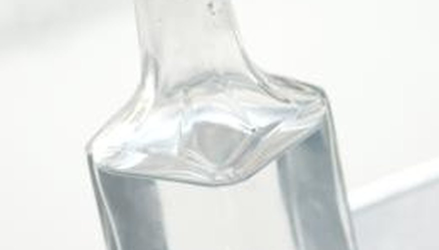 Vinegar breaks down sticky residue on glasses. Vinegar breaks down sticky residue on glasses.