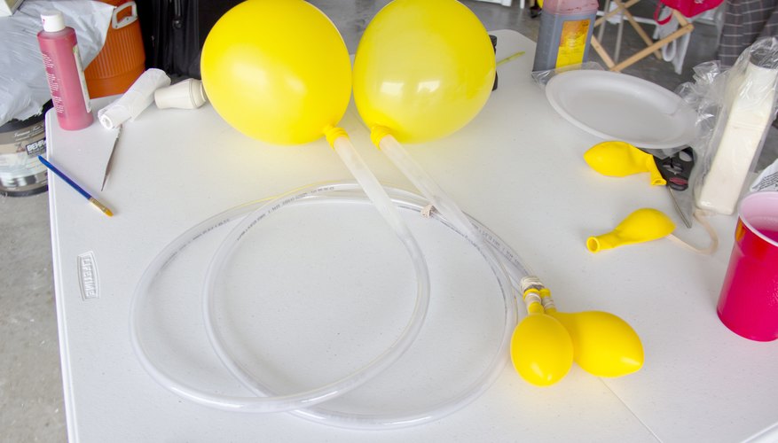 Inflate the double-layered balloons and allow air to flow to single balloons.