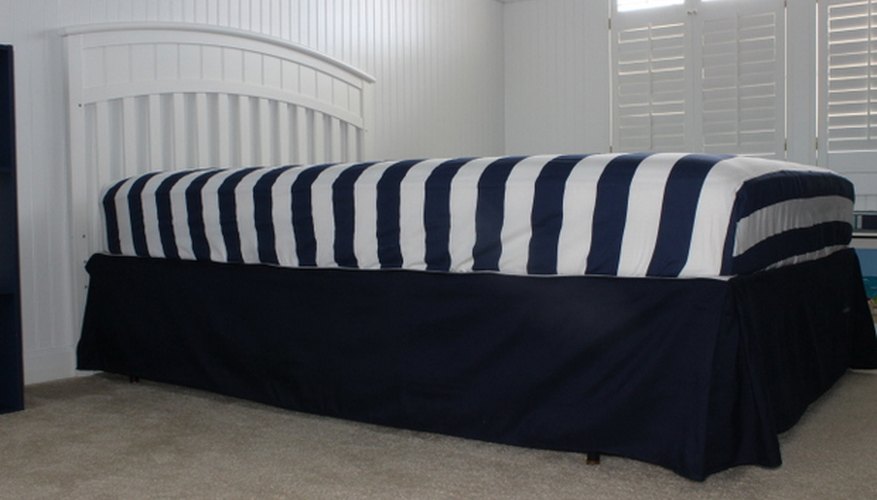 Be careful not to move the bed-skirt when setting the mattress down. Be careful not to move the bed-skirt when setting the mattress down.