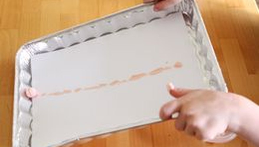 Tilt the pan to move the marble. Tilt the pan to move the marble.