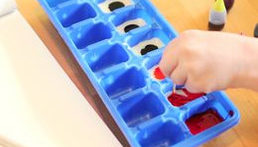 Mix food coloring with condensed milk to create the edible paint colors. Mix food coloring with condensed milk to create the edible paint colors.