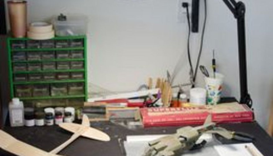 Set up a modeling desk where your tools and materials won't be disturbed. Set up a modeling desk where your tools and materials won't be disturbed.