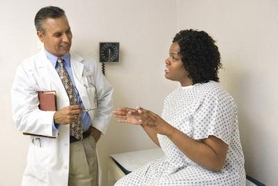 Woman talking with doctor