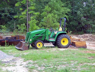 How to Use a John Deere Loader SCV Lever | eHow